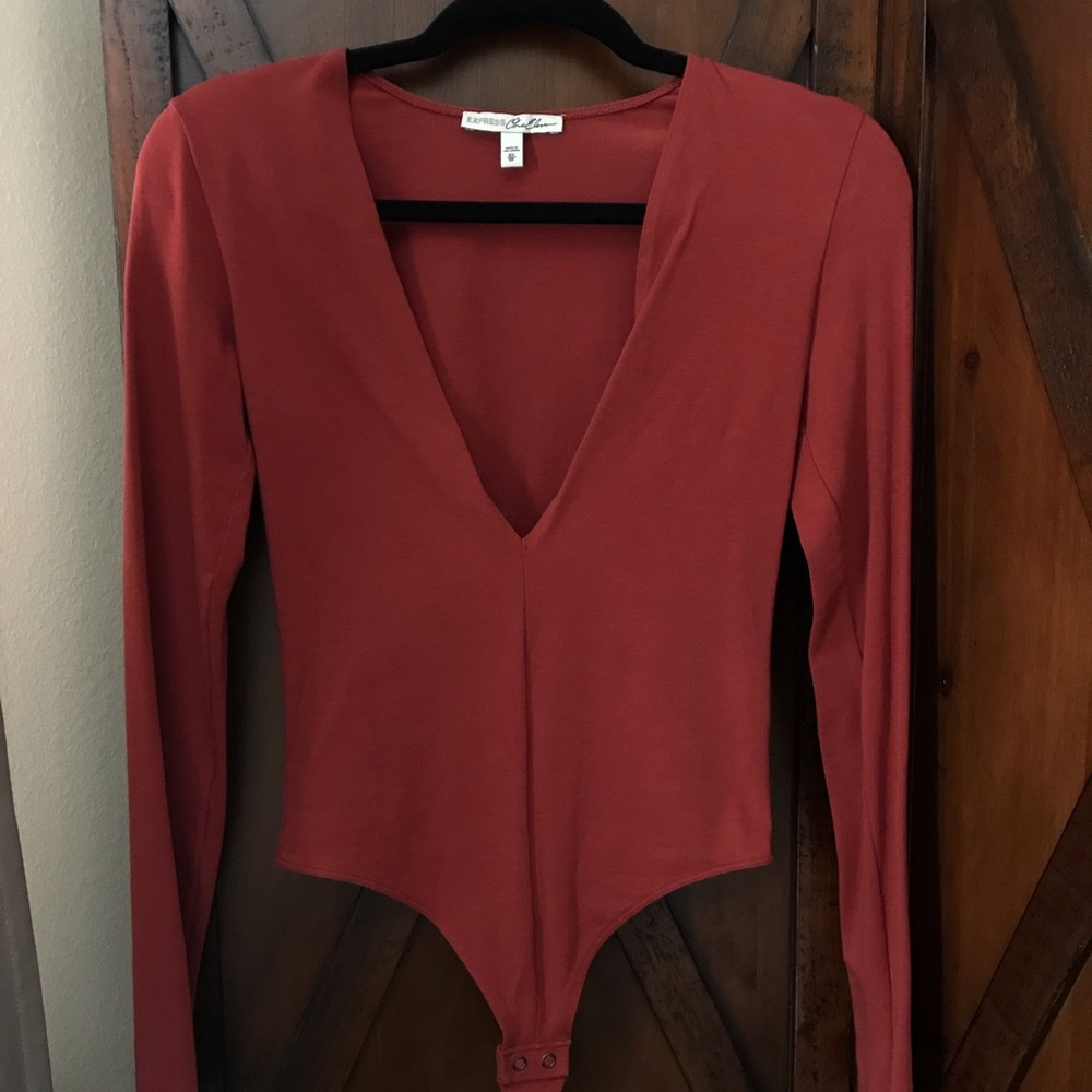 Deep V neck long sleeve shirt. Off red color.